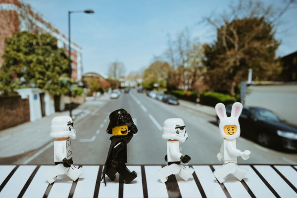 photo of four LEGO dolls walking across abbey road