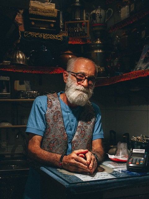 portrait of a male shopkeeper in Tehran