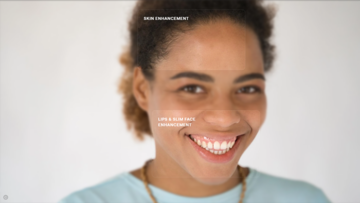 An image of a woman smiling is being edited with skin, lip, and slim face enhancement on Luminar AI.